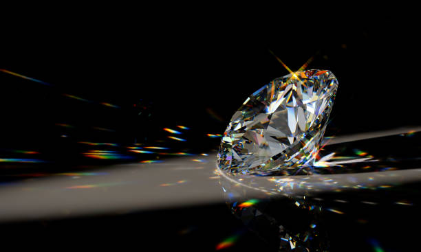 istock Round cut diamond on black background with beautiful colorful caustics rays 1148262037