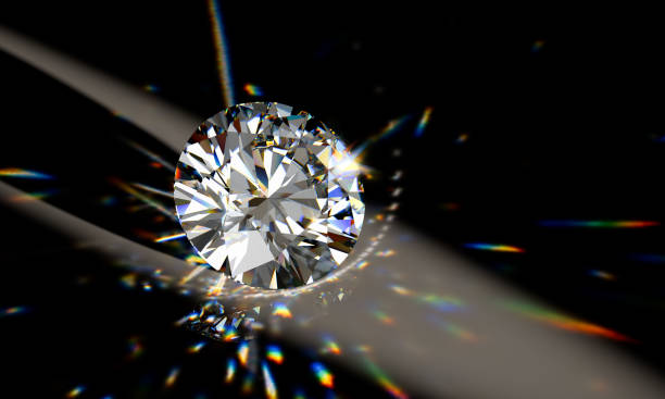 istock Round cut diamond on black background with beautiful colorful caustics rays 1148262039
