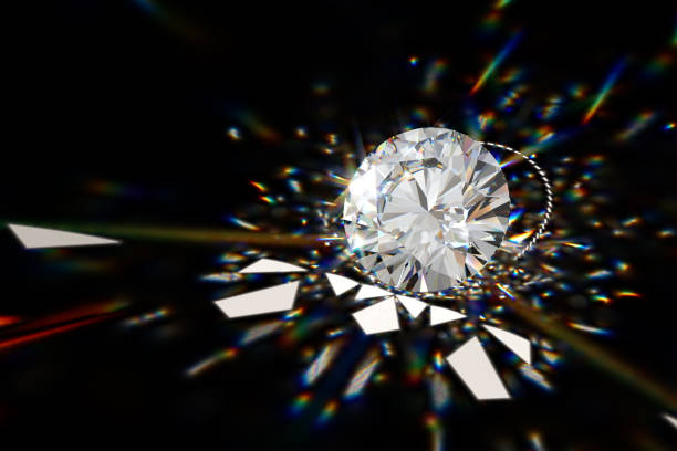 istock Round cut diamond on black background with beautiful colorful caustics rays 1148262072