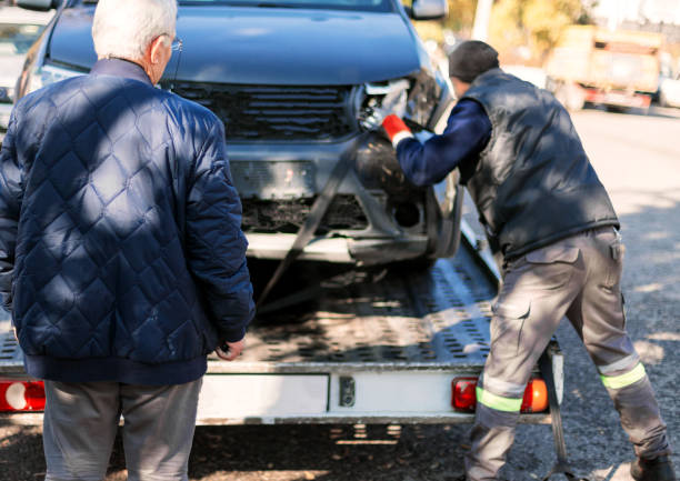 istock Car loaded onto tow truck 1148262276