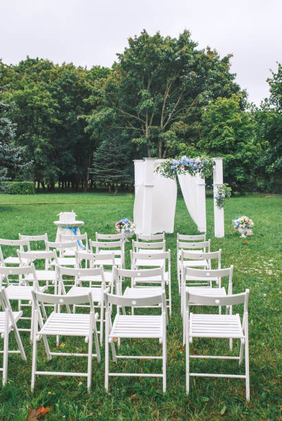 istock rectangular wooden wedding arch decorated with flowers and fabric for a wedding ceremony on the meadow 1148264620