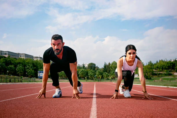 istock Young couple athlete training on a race track 1148267693