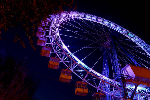 istock Ferris wheel with color lighting against a night blue sky 1148271178
