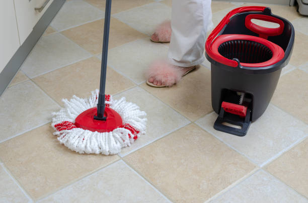 istock Mop, bucket and woman's feet 1148273003