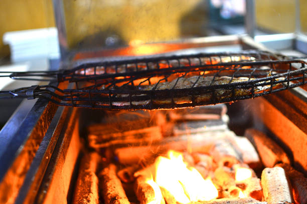 istock Bbq grilled fish. Fish is fried on a grid on fire. 1148274782