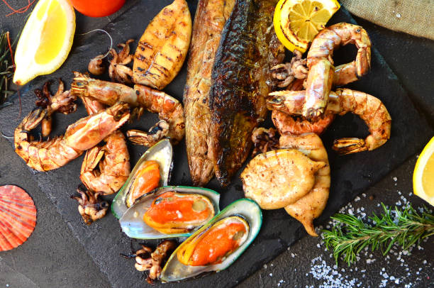 istock Mediterranean dinner with a grilled seafood. Close up. 1148274949