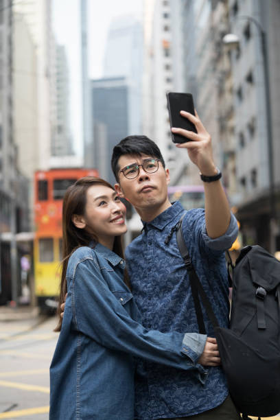 istock Young couple taking selfie in Hong Kong 1148276970