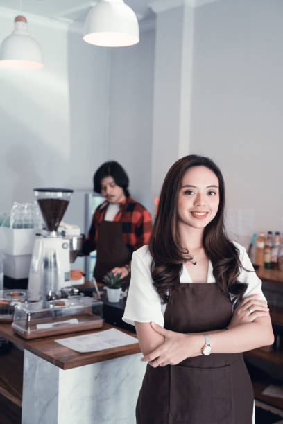 istock asian cafe owner smiling to camera 1148277105