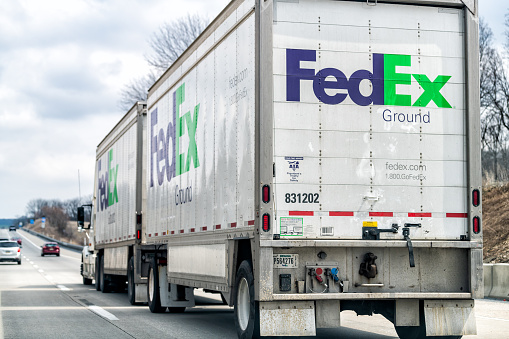 Hamburg, USA - April 6, 2018: Highway 78 in Pennsylvania road with large FedEx or Federal Express truck and cars in traffic