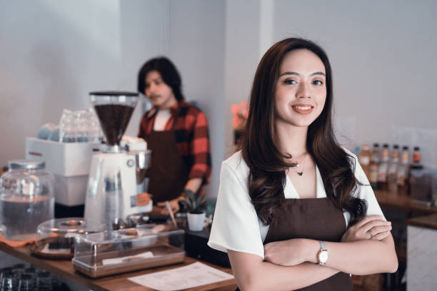 istock waiter with apron close up 1148279876