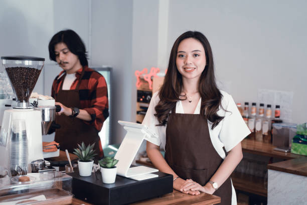 istock asian cafe owner smiling to camera 1148279917