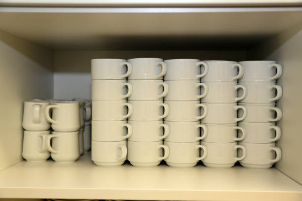 istock White coffee mugs stacks stand in the closet 1148282686