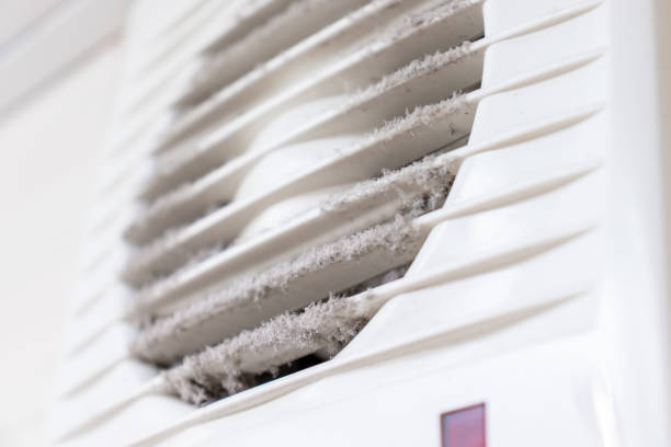 istock Extremely dirty and dusty white plastic ventilation air grille at home close up, harmful for health 1148285916