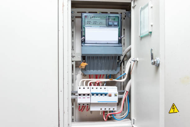 istock Automatic switches with wires and electricity meter in electrical shield close up 1148286000