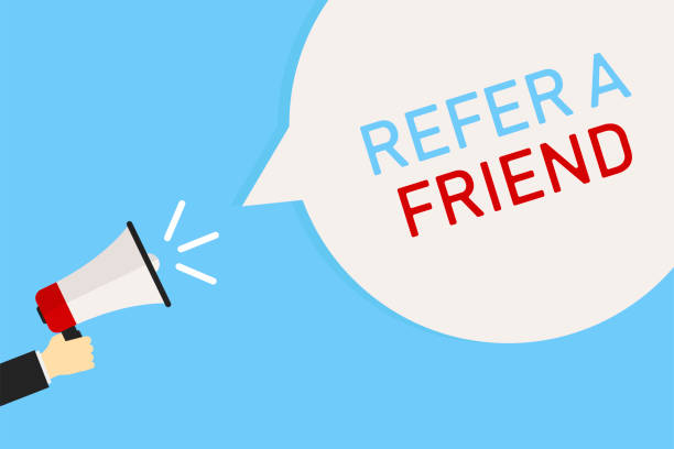 istock Hand holding megaphone. Marketing banner on blue background. Loudspeaker with phrase REFER A FRIEND. 1148287618