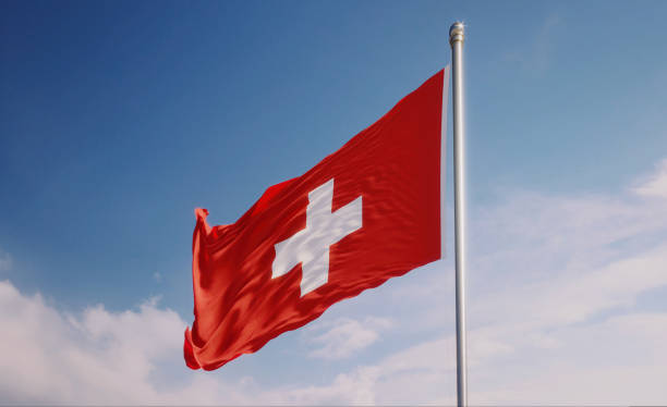 istock Swiss Flag Waving With Wind Over Blue Sky 1148290247