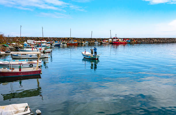 Trabzon, Turkey - April 17, 2019: Alaplı fishing port. Alaplı is a little fishing port at northern Turkey Mediterranean sea. There are a lot of fisherman make a living by fishing. stock photo