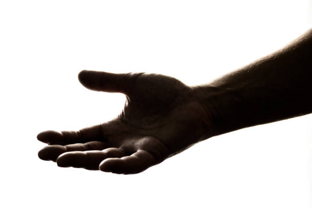 istock Silhouette of hand reaching out 1148292180
