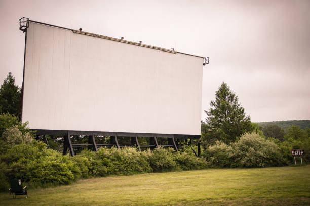 Drive-In Theater movie screen stands in the distance stock photo