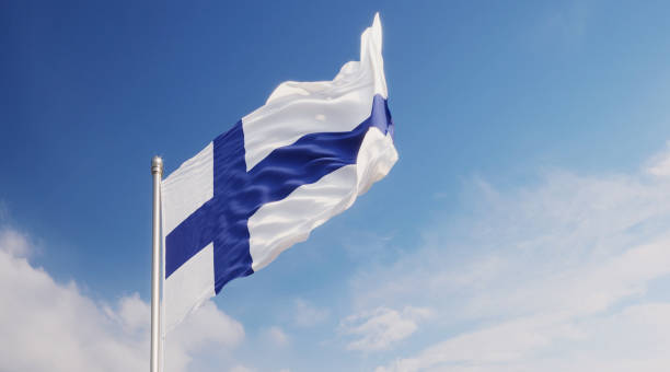 istock Finnish Flag Waving With Wind Over Blue Sky 1148293146