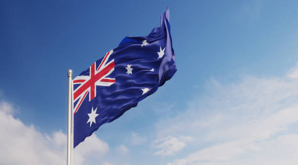 istock Australian Flag Waving With Wind Over Blue Sky 1148293965