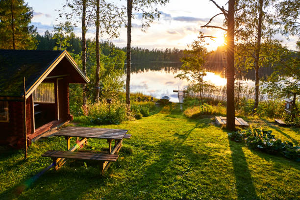 Summer holidays in Finland The lakes in Finland are a great place to spend the summer holidays with the whole family log cabins stock pictures, royalty-free photos & images