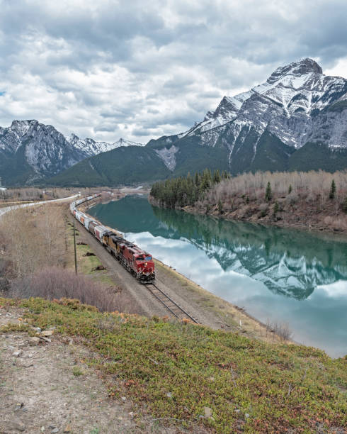istock Rocky Mountain Train beside the Bow River at Exshaw 1148296456