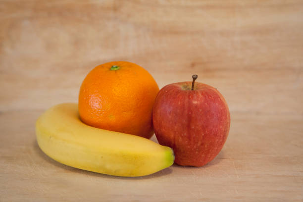 istock Healthy fruits on wood background 1148296482