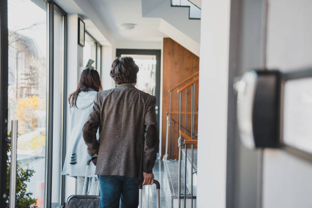 istock Mature couple walking indoors with suitcases 1148298461