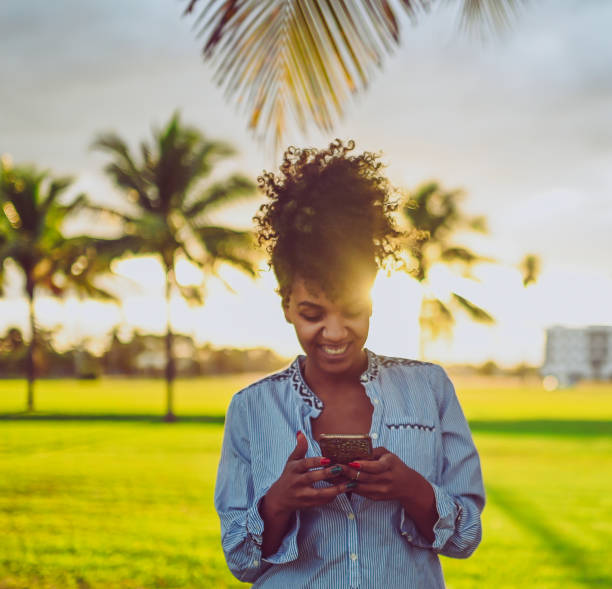 istock African American woman outdoors using a smart phone 1148320455
