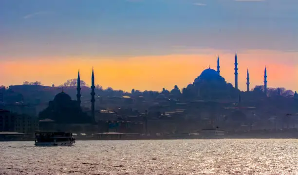 Photo of Beautiful View touristic landmarks from sea voyage on Bosphorus. Cityscape of Istanbul at sunset