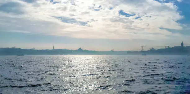 Photo of Beautiful View touristic landmarks from sea voyage on Bosphorus. Cityscape of Istanbul at sunset