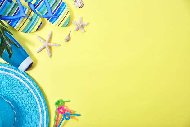istock Flip-flops and Shower cream with colourful ring floating yellow background with copy space 1148332431