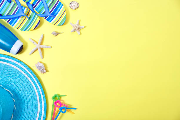 istock Flip-flops and Shower cream with colourful ring floating yellow background with copy space 1148332438