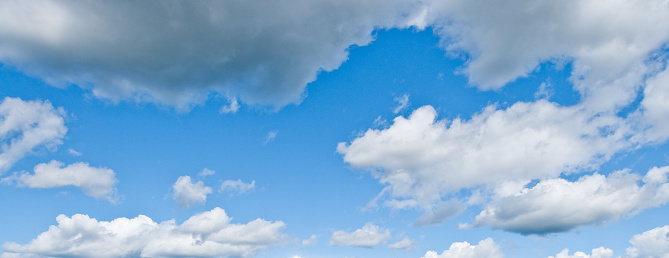 Cumulus clouds appear in a blue sky over Mima Mounds Natural Area Preserve near Olympia, Washington State, USA.