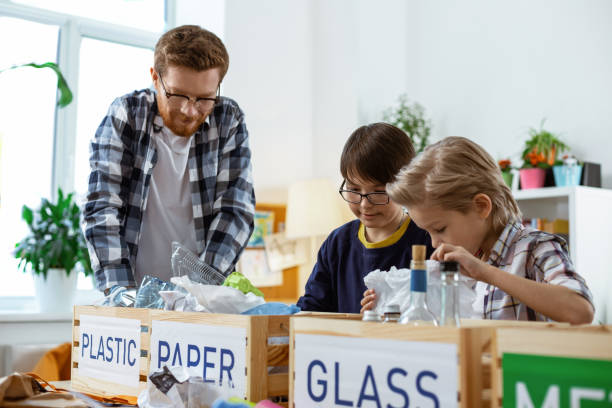 istock Ginger teacher in clear glasses explaining recycling bases 1148332686