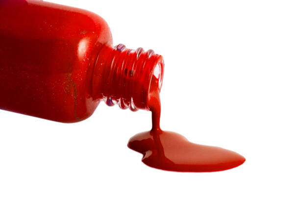 istock Red Nail Polish Closeup isolated on the white background 1148333893