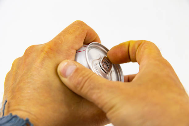 istock Aluminum can for drinks in the hands of man 1148334162