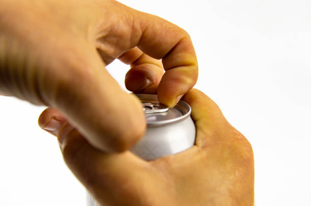istock Aluminum can for drinks in the hands of man 1148334992