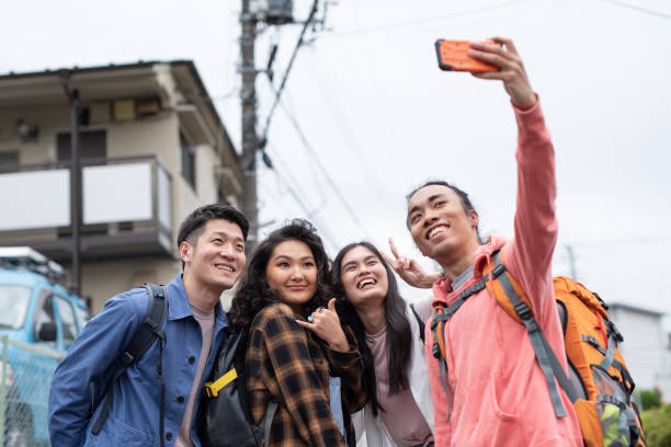 istock Tourists taking selfie on street 1148336203