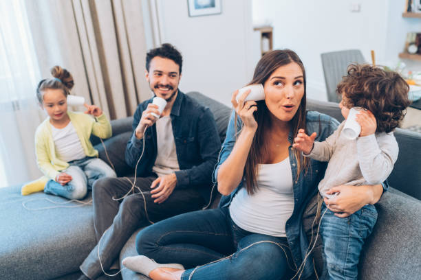 istock Family having fun with string phones 1148336510