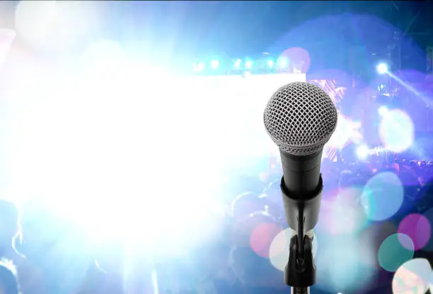 Close up dynamic microphone  on stage in music festival. Let's sing