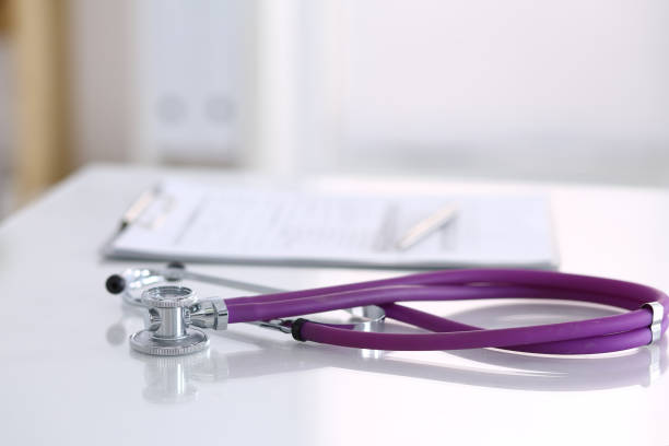istock Medication history record form lying on table with stethoscope and silver pen. Medicine or pharmacy concept. Medical tools at doctor working table 1148338146