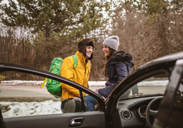 istock Yong couple resting on a car 1148338513