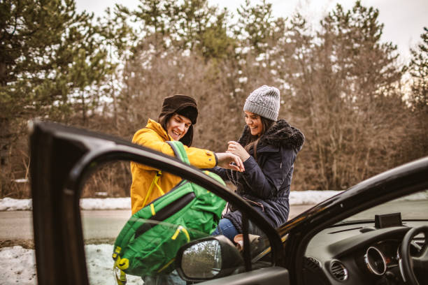 istock Yong couple resting on a car 1148338547