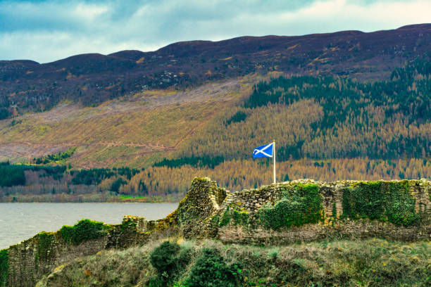 Urquhart Castle, Loch Ness, Scottish Highlands near Drumnadrochit, UK Drumnadrochit, Scotland - March 26, 2019:  Urquhart Castle was built in the 13th Century on the site of an early medieval fortification. Urquhart Castle played a role in the Wars of Scottish Independence. Through conflict it was possessed by many Scottish clans over the centuries.  Urquhart Castle was partially destroyed in 1692 to prevent its use by Jacobite forces.  In more modern times it is a tourist attraction on the banks of Loch Ness. drumnadrochit stock pictures, royalty-free photos & images