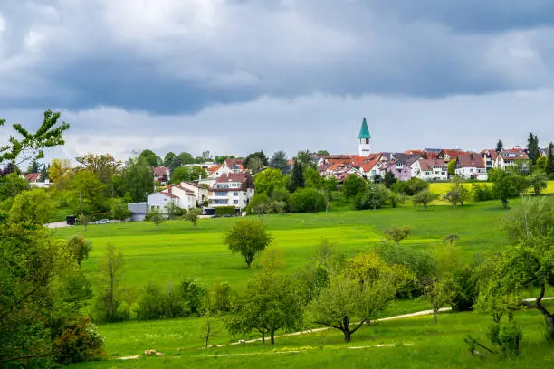 Germany, Dreamy town ostfildern kemant behind green nature countryside in spring