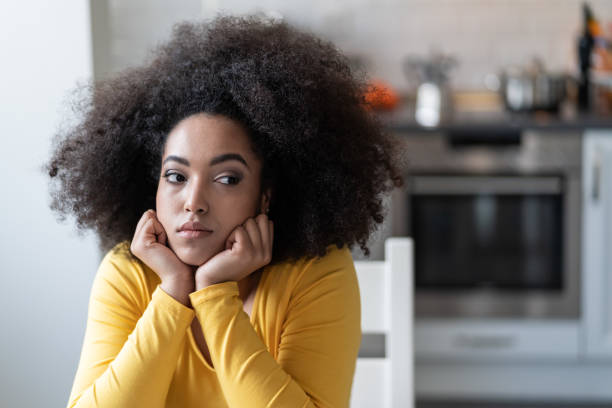 istock Depressed afro woman at home 1148355048