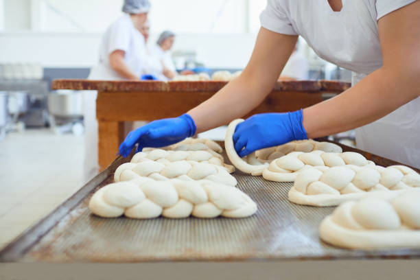 istock Raw baked dough lies on the table before baking at the bakery. 1148355476