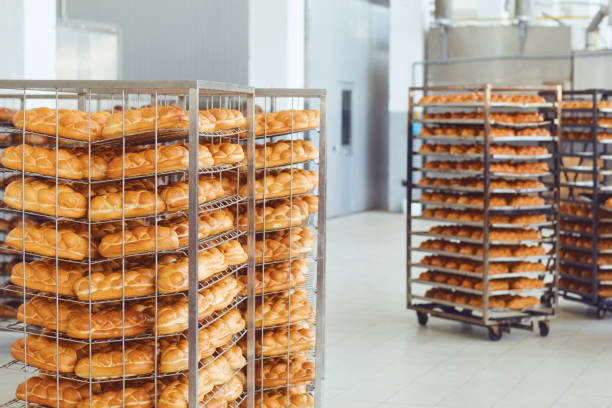 istock Tray with fresh brown bread at the bakery. 1148355495